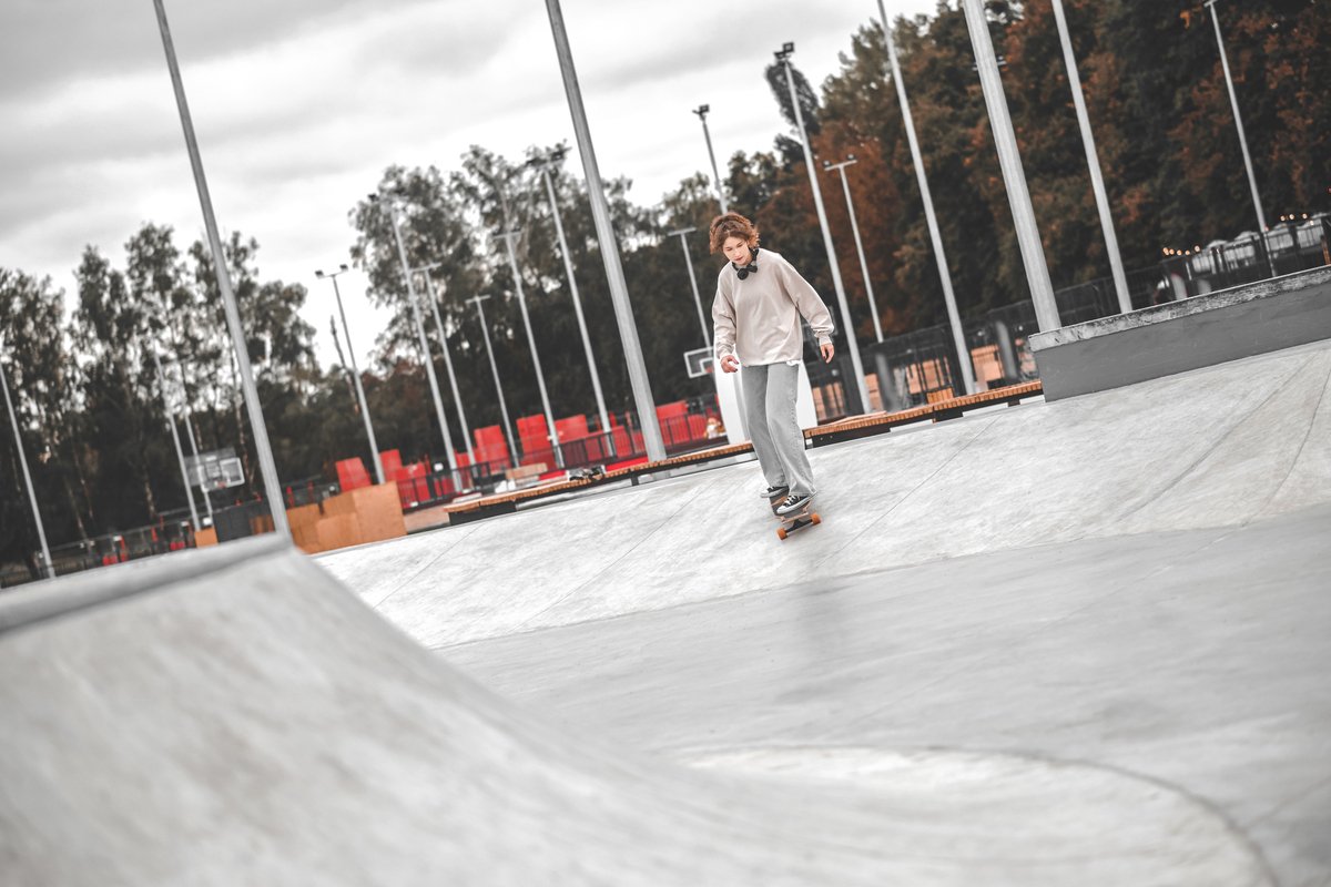Girl riding up on sketboard in park