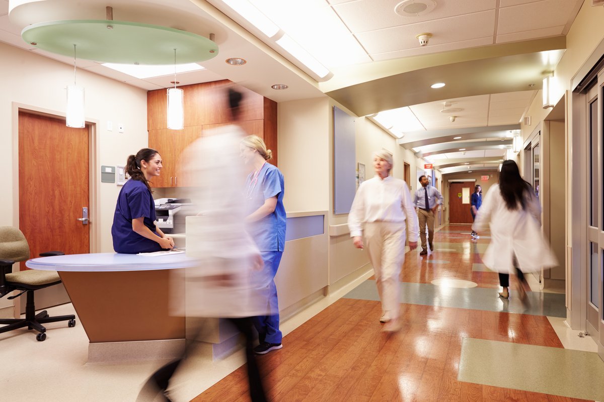 Busy Nurse’s Station In Modern Hospital