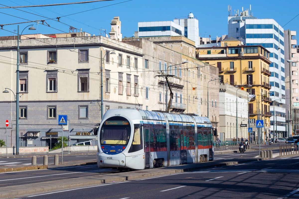 View of the modern tram in the one of the central streets of Naples.